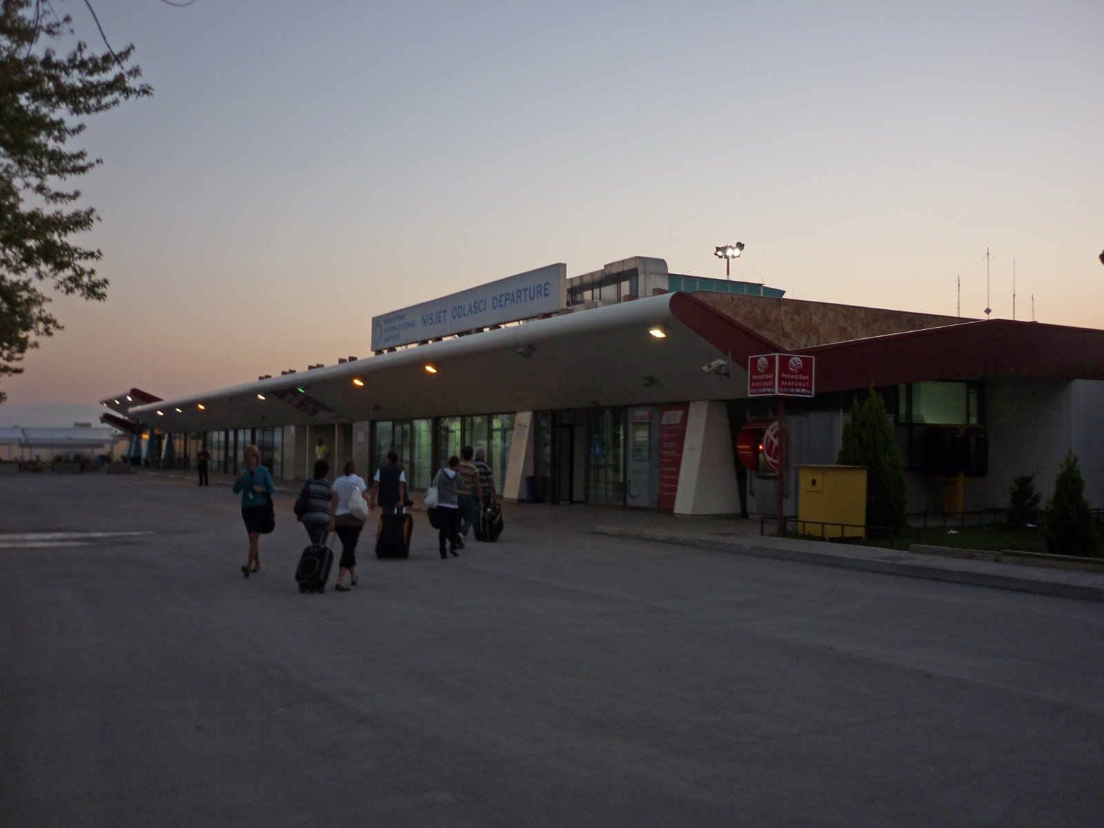 An airport terminal concourse with departure gates